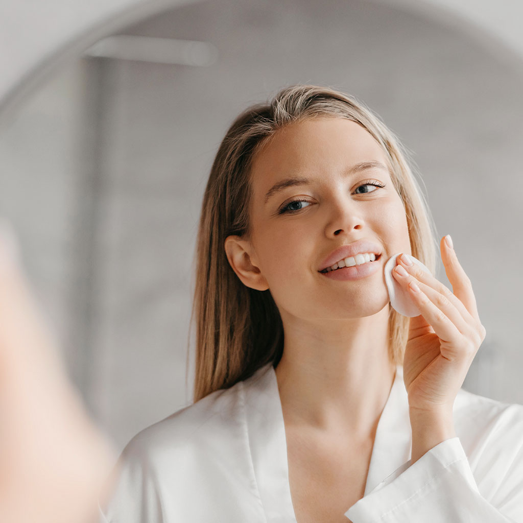 Woman cleaning skin