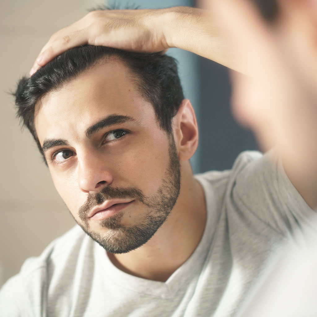 Man checking his hair