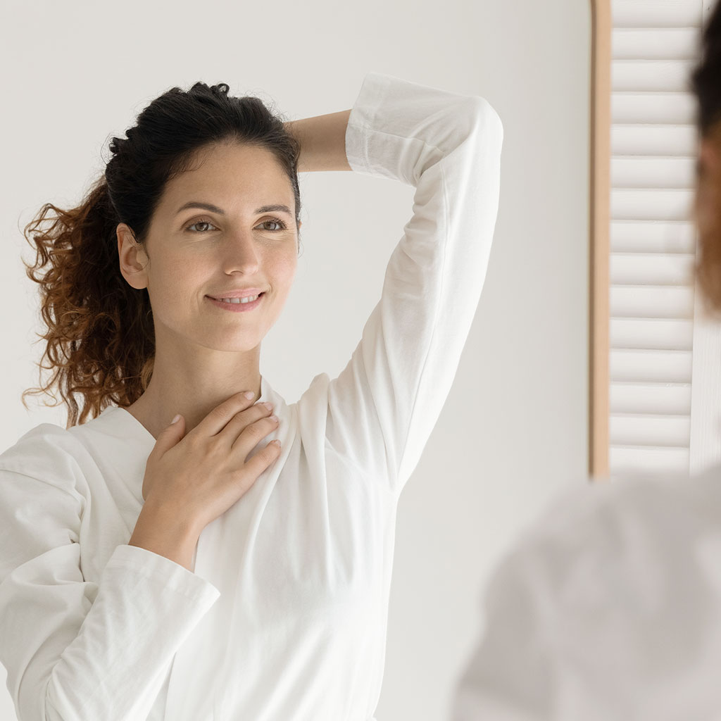 Woman Smiling In Mirror