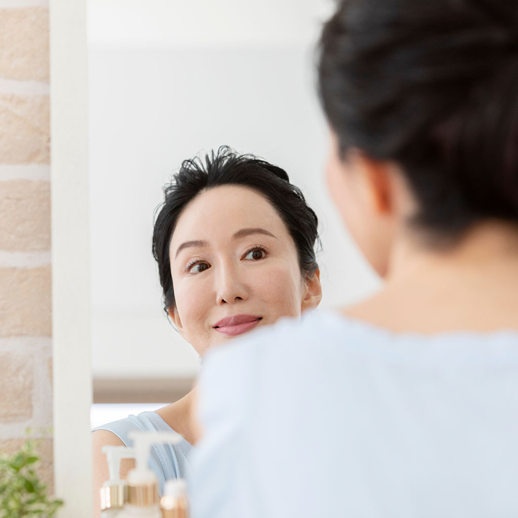 Asian lady in mirror